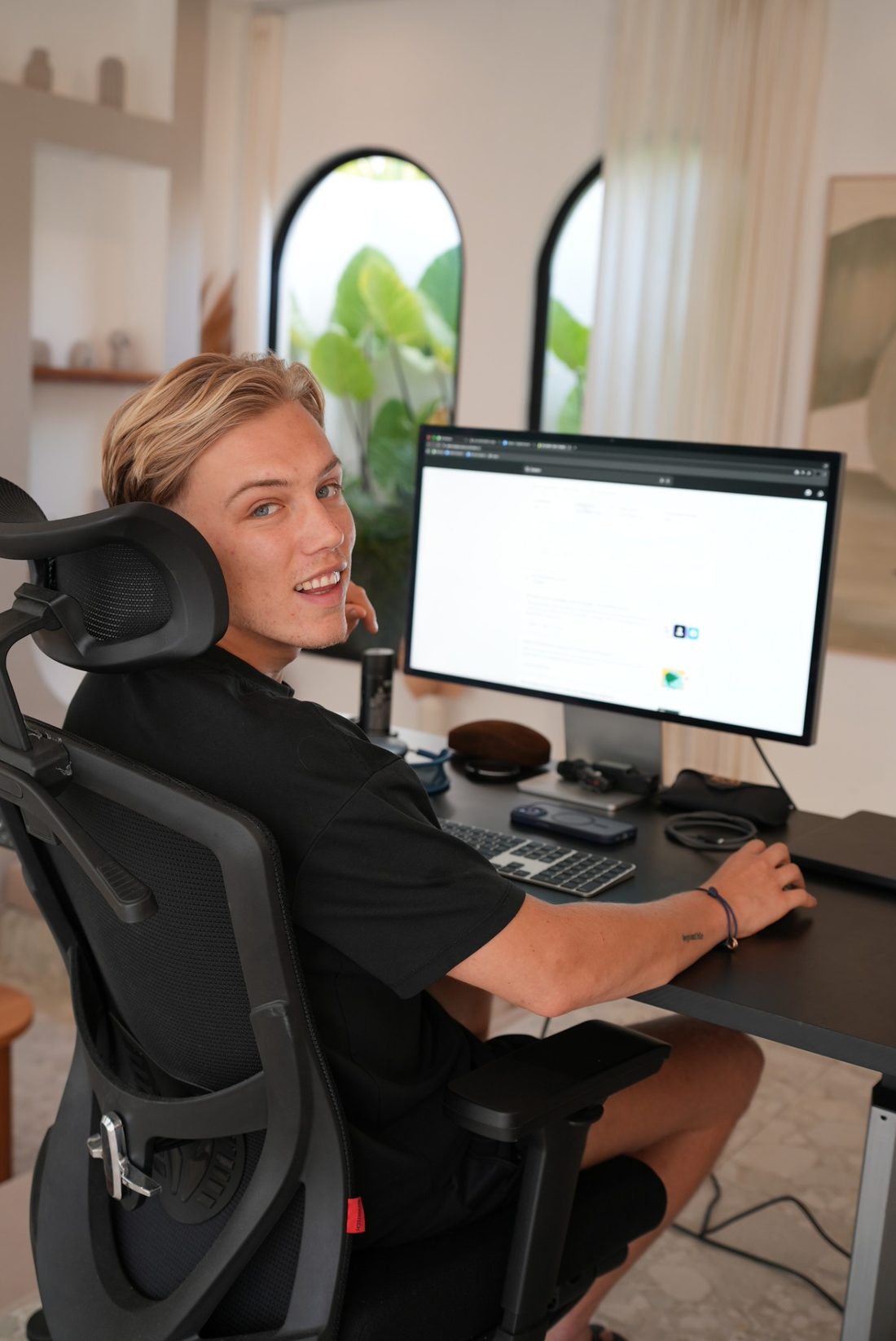 Ben Tol smiling at his desk